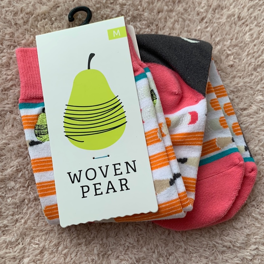Woven Pear’s “Stay Sharp” socks in White, Grey, Pink, Black, Tan, and Orange